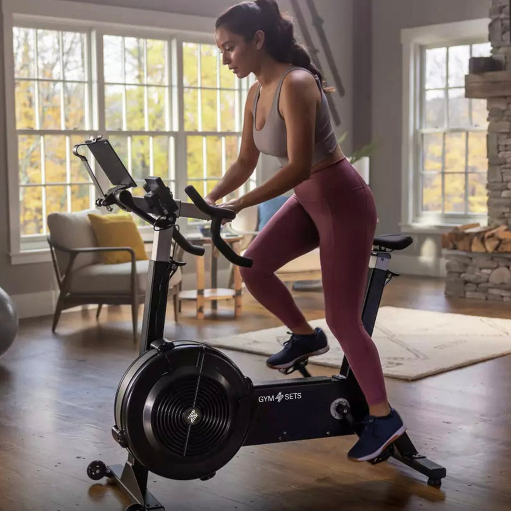 Air resistance exercise bike with freewheel clutch and belt drive - view 10