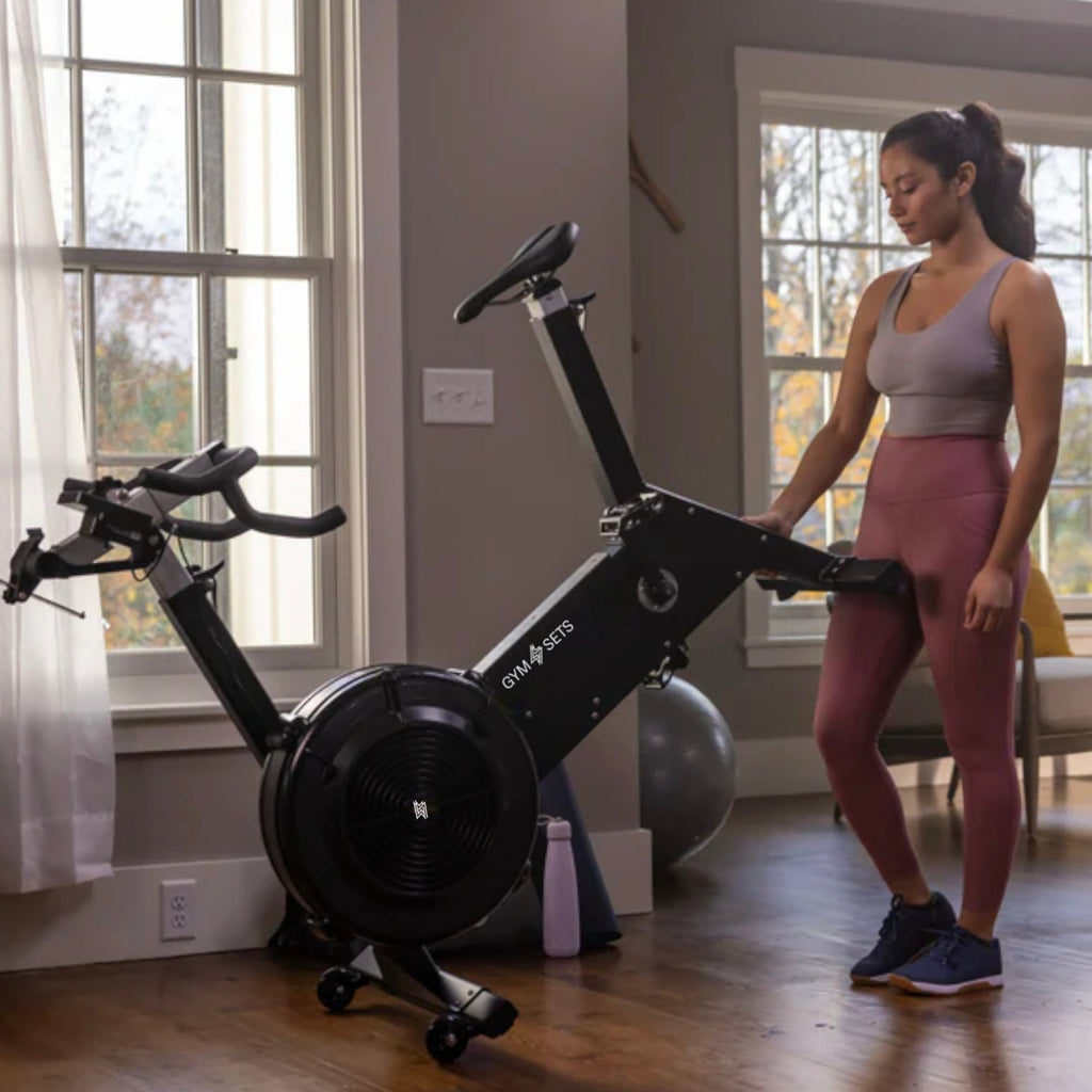 Air resistance exercise bike with freewheel clutch and belt drive - view 11