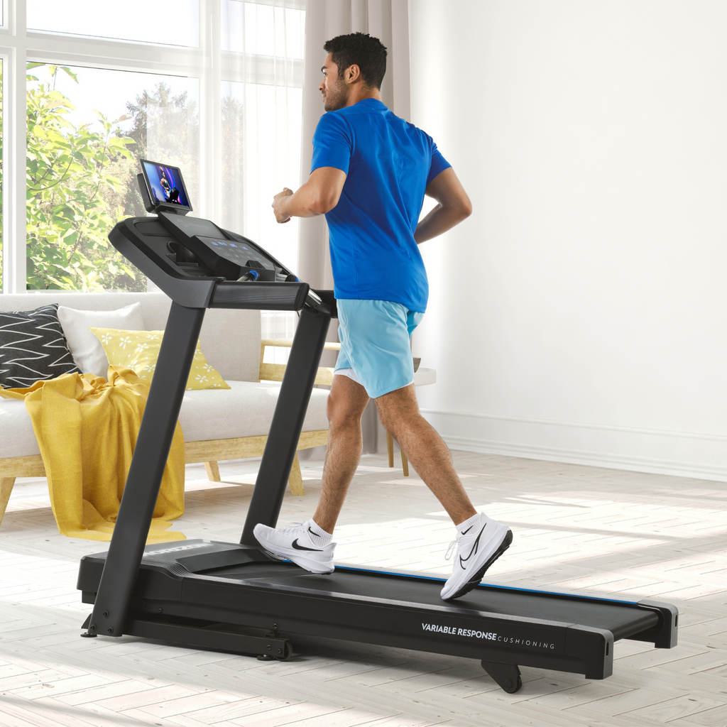 Folding treadmill with thumb-dial controls and hydraulic fold - view 12